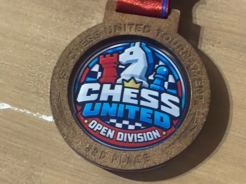 Close-up of the bronze Chess United Tournament 1.0 medal for 3rd place in the Open Division.